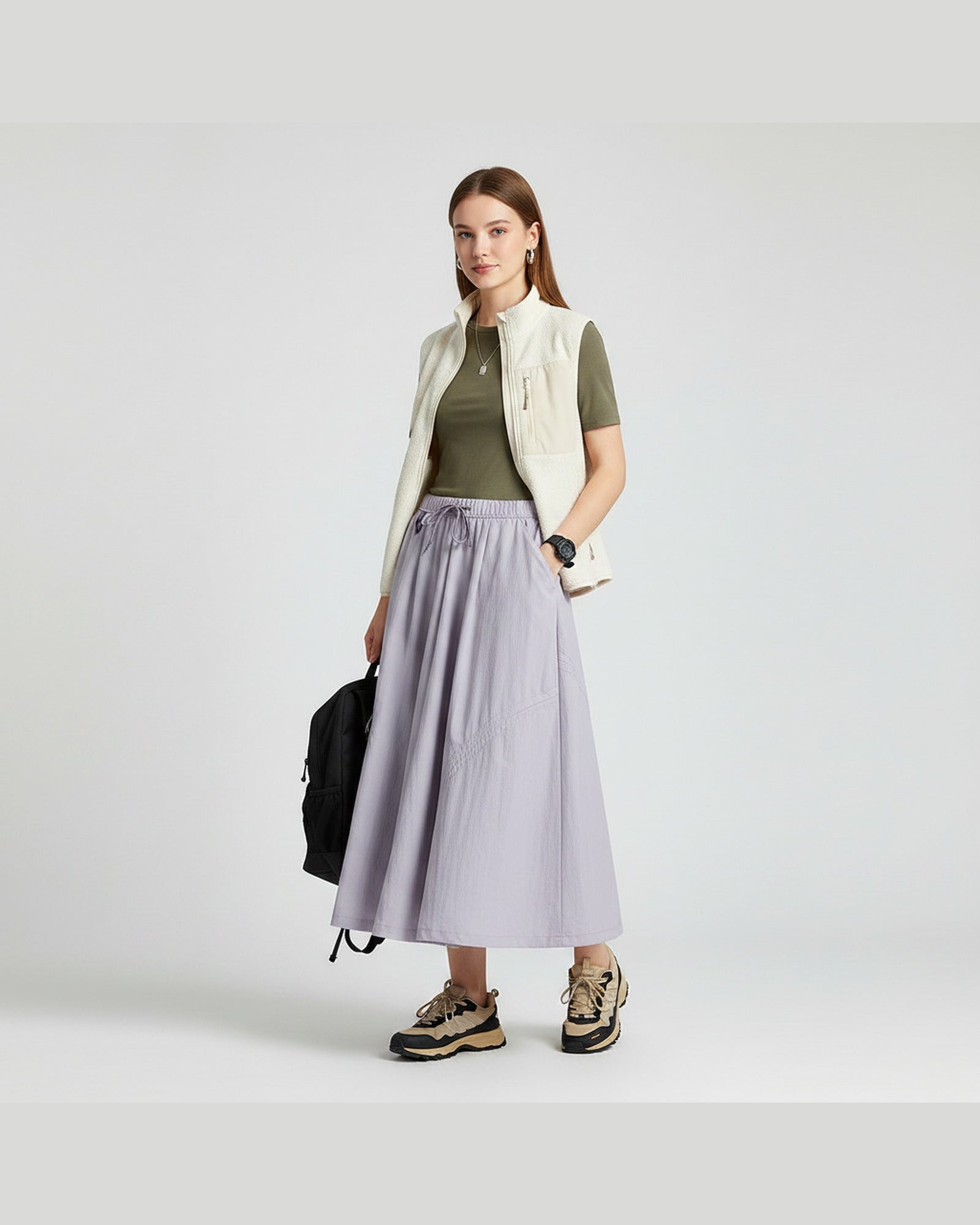 Model in violet mist technical A-line cargo skirt with adjustable drawstring hem and side pockets