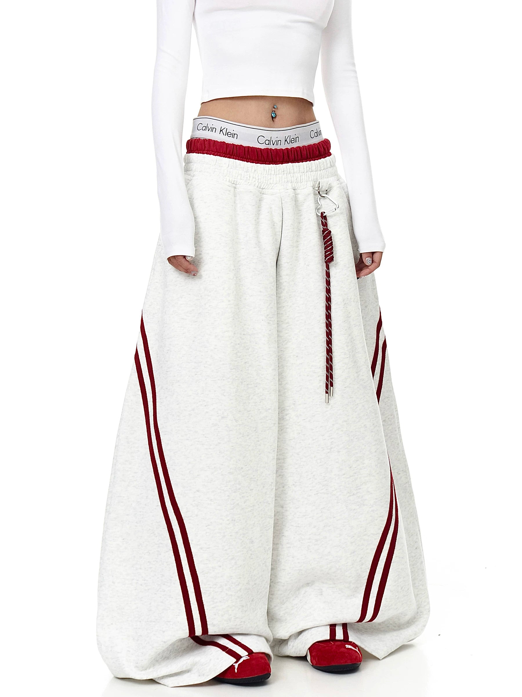 Gray baggy striped sweatpants styled on a model - Techwearofficial