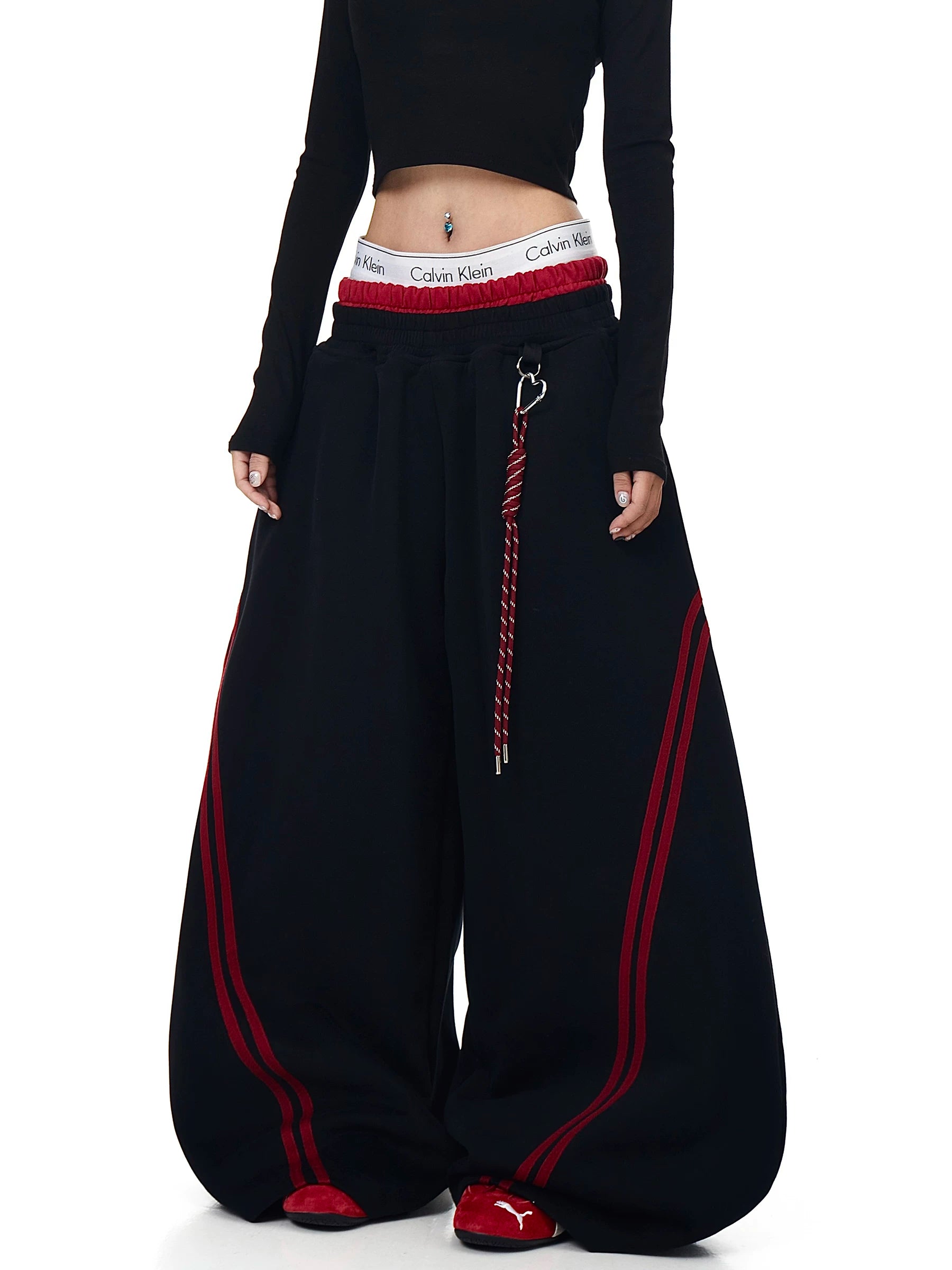 Black double-waist striped sweatpants on a model - Techwearofficial