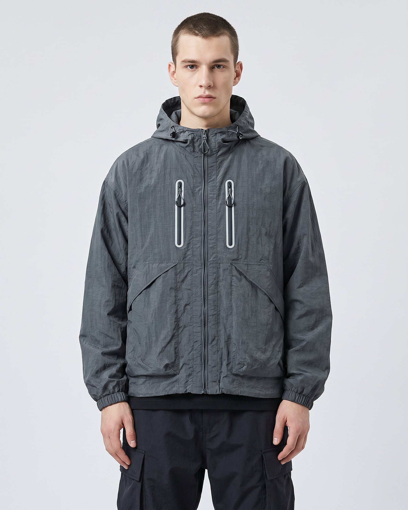 European male model in Alpine Blue hooded softshell windbreaker jacket, front view, clean studio e-commerce