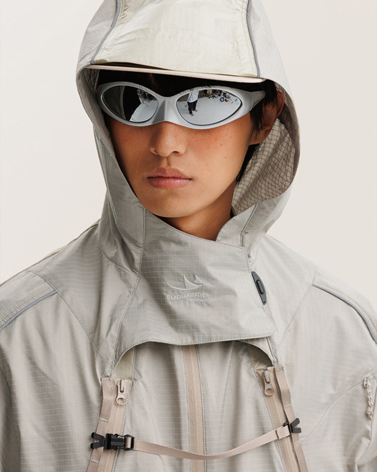 2-in-1 detachable jacket hood and funnel collar detail with woven brand embroidery, chest webbing buckles and ripstop check fabric
