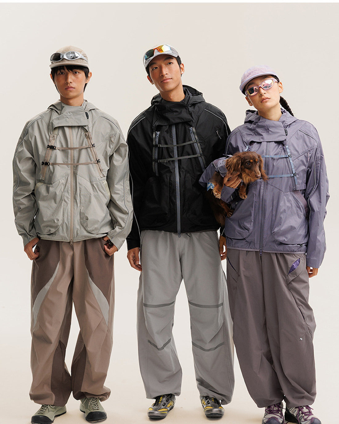 BLACKARMADA 2-piece hooded jacket and vest set worn by three models in Midnight Black, Sandstone Khaki and Mist Lavender, outdoor techwear lifestyle