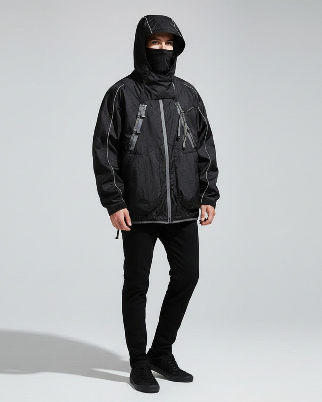 Midnight Black BLACKARMADA 2-piece hooded jacket vest set on male model, urban outdoor techwear, full body studio