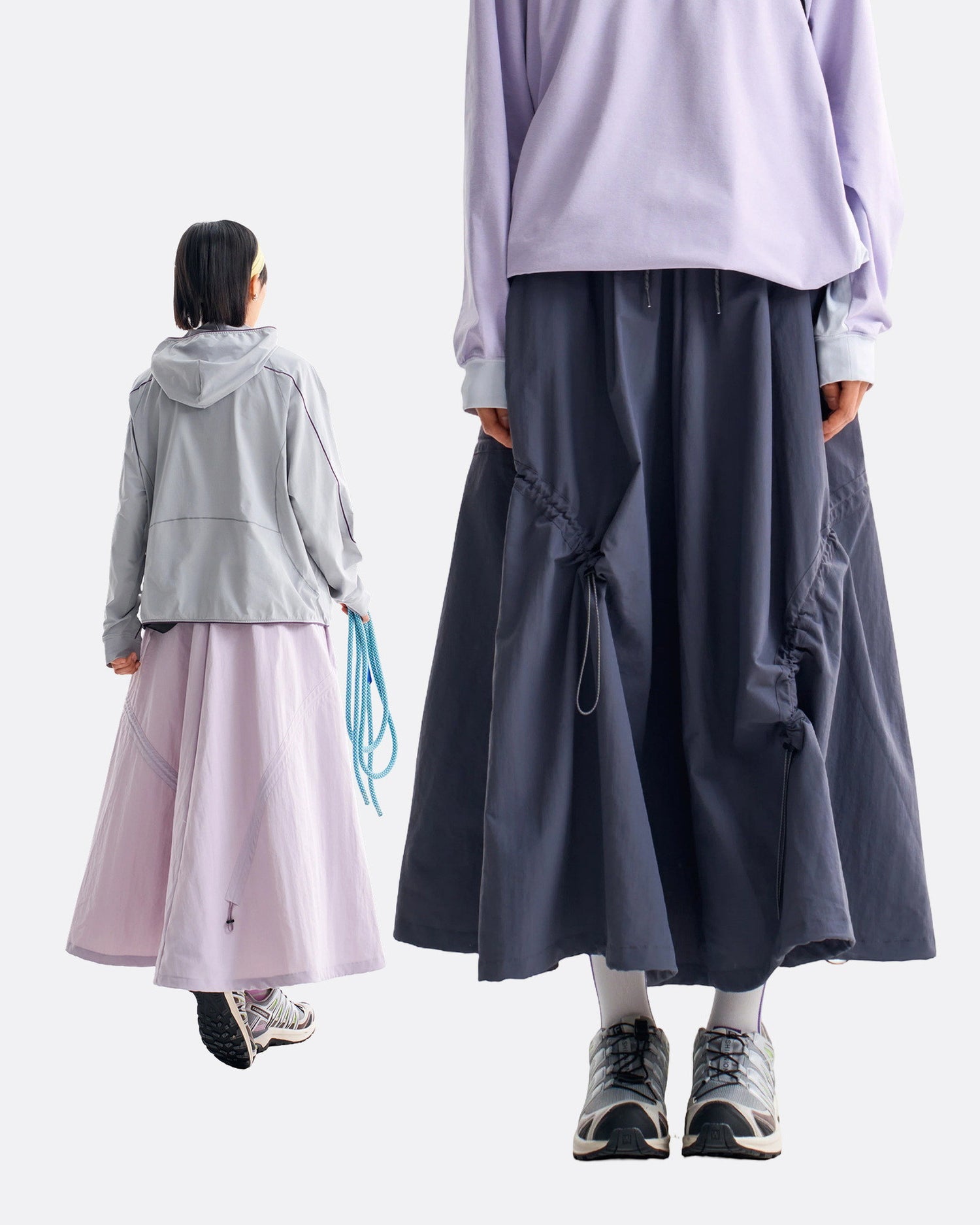 Back view of violet mist and ink blue technical cargo skirts showing rear drawstring and full flared hem