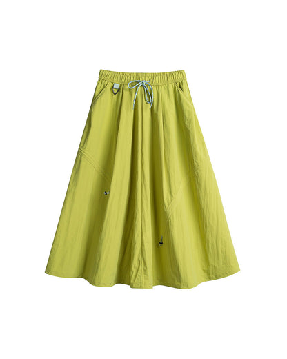 Lime green technical cargo skirt flat lay with drawstring waist and adjustable A-line hem