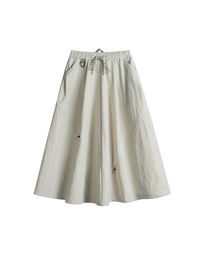 Ivory white technical cargo skirt flat lay with drawstring waist and side pockets