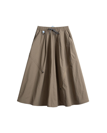 Mocha brown technical cargo skirt flat lay with curved seam and drawstring detail