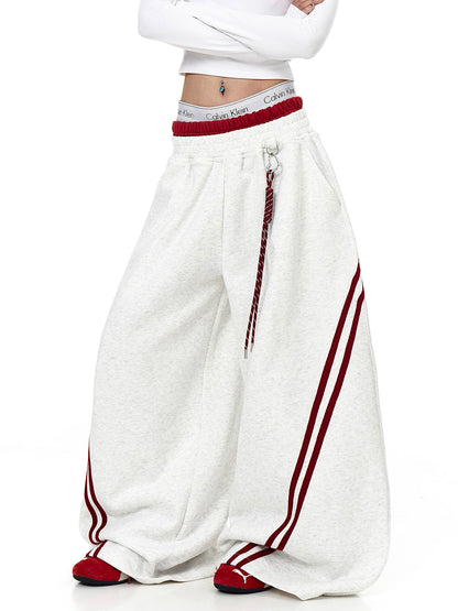 Gray curved-leg sweatpants with contrast red stripes - Techwearofficial