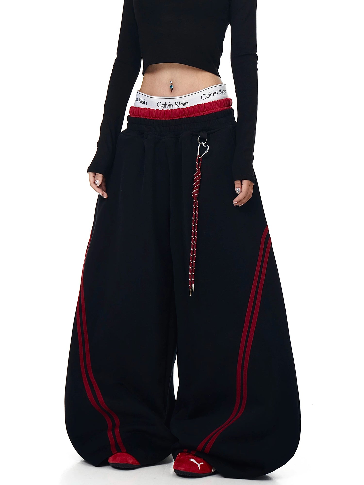 Black double-waist striped sweatpants on a model - Techwearofficial