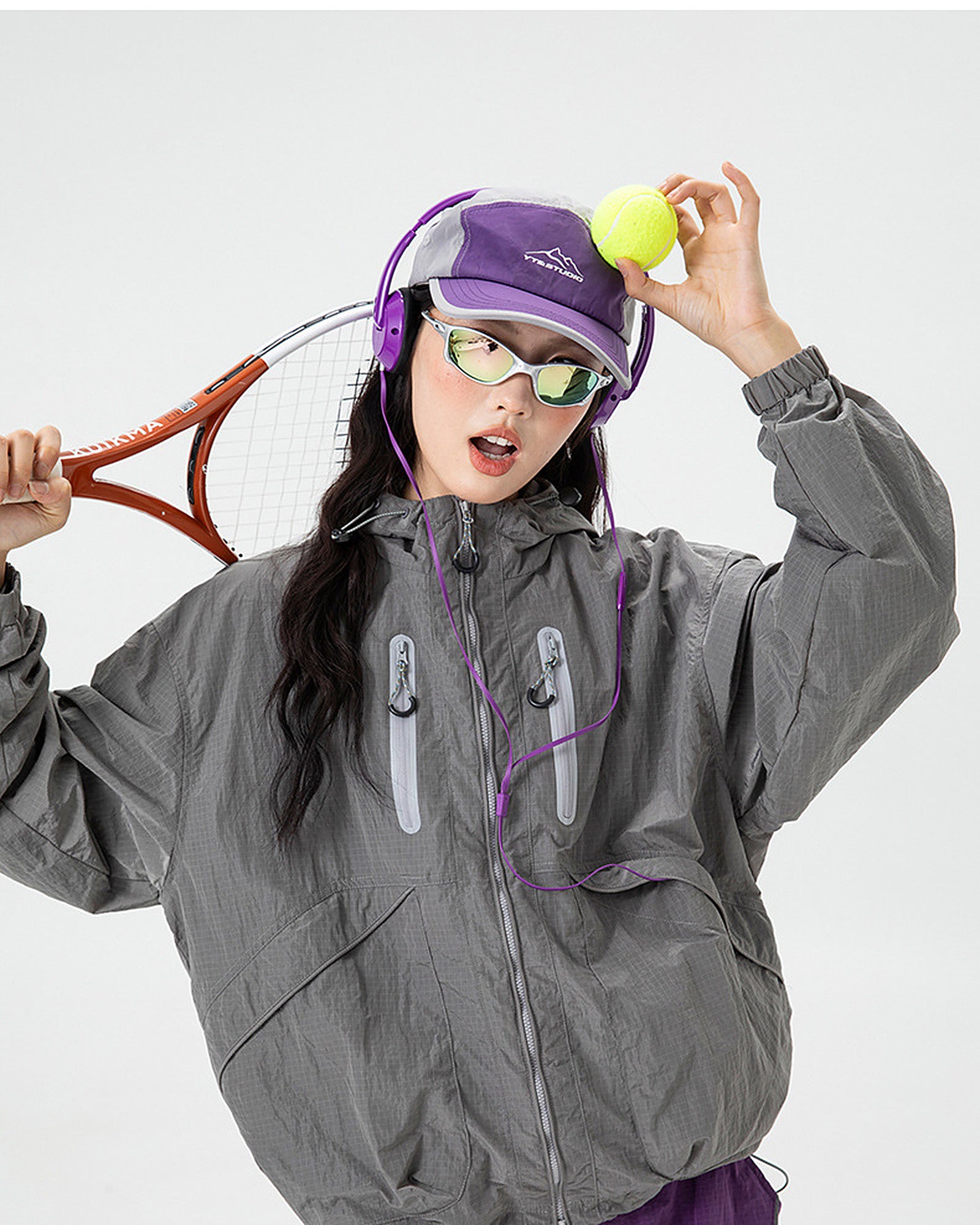 Shadow Grey softshell windbreaker jacket detail, twin reflective chest zip pockets and hood drawcord