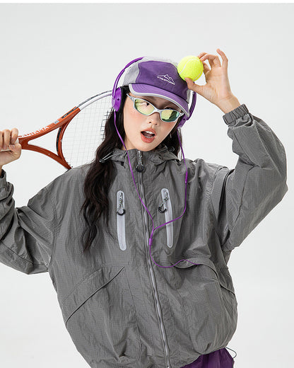 Shadow Grey softshell windbreaker jacket detail, twin reflective chest zip pockets and hood drawcord