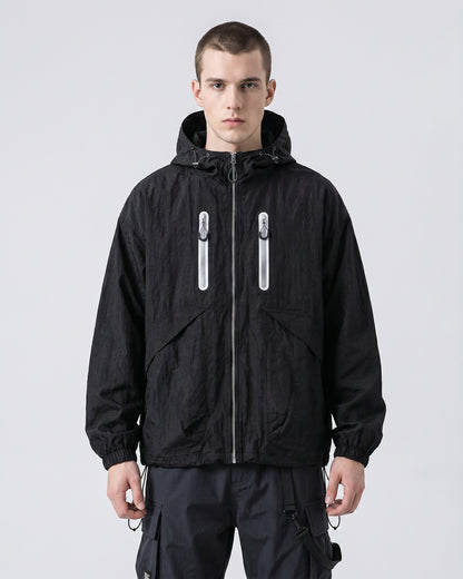 European male model in Obsidian Black hooded softshell windbreaker jacket, front view, clean studio e-commerce