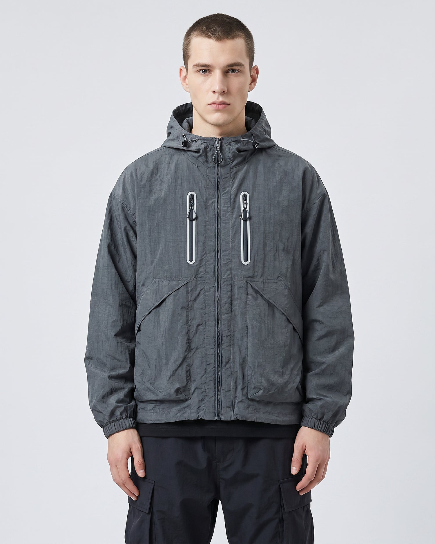 European male model in Alpine Blue hooded softshell windbreaker jacket, front view, clean studio e-commerce