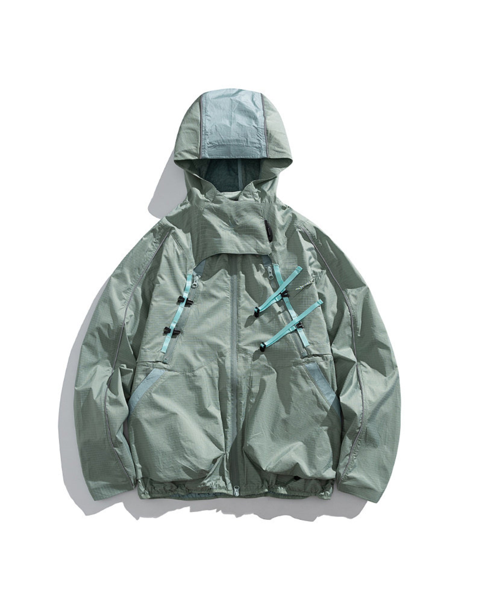 Bamboo Green 2-in-1 detachable hooded shell jacket flat lay front with teal webbing buckles, fresh sage outdoor techwear