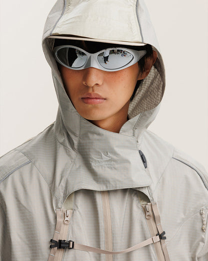 2-in-1 detachable jacket hood and funnel collar detail with woven brand embroidery, chest webbing buckles and ripstop check fabric